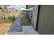 View of the backyard showing a walkway, fence, and the exterior of the home at 45 Sandra Cir, New Smyrna Beach, FL 32168