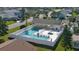 Aerial view of the community pool area, featuring a pool, hot tub, and covered seating area at 45 Sandra Cir, New Smyrna Beach, FL 32168