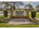 Welcoming community sign for Hidden Pines Townhomes & Villas, a beautiful place to call home at 456 Shorewood Ln, New Smyrna Beach, FL 32168