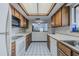 Kitchen featuring ample counter space, wooden cabinets, and an open view to the dining area at 456 Shorewood Ln, New Smyrna Beach, FL 32168