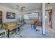 Cozy living room with a ceiling fan, railing, and lots of natural light at 456 Shorewood Ln, New Smyrna Beach, FL 32168