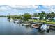 Aerial view of a waterfront community featuring boat docks and beautiful landscaping at 47 Jacaranda Cay Ct # 470, New Smyrna Beach, FL 32169