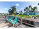 Scenic waterfront with Adirondack chairs overlooking a community gazebo, fire pit, and kayaks at 47 Jacaranda Cay Ct # 470, New Smyrna Beach, FL 32169