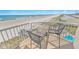 Balcony with comfortable seating and a gorgeous ocean view at 4767 S Atlantic Ave # 404, Ponce Inlet, FL 32127