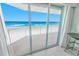 Balcony featuring ocean views, sliding glass doors, tile floors and a seating area at 4767 S Atlantic Ave # 404, Ponce Inlet, FL 32127