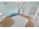 Bright bedroom with hardwood floors, a daybed, and a full ensuite bathroom at 4767 S Atlantic Ave # 404, Ponce Inlet, FL 32127