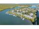 Aerial view of a waterfront community with boat docks and waterfront access at 49 Jacaranda Cay Ct # 49, New Smyrna Beach, FL 32169