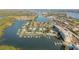 High aerial shot of waterfront community featuring condo buildings, boat docks, and direct water access at 49 Jacaranda Cay Ct # 49, New Smyrna Beach, FL 32169