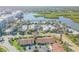 Aerial view of the community with lush landscaping and waterfront access at 49 Jacaranda Cay Ct # 49, New Smyrna Beach, FL 32169