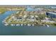 Aerial view of a waterfront community with boat docks at 49 Jacaranda Cay Ct # 49, New Smyrna Beach, FL 32169