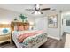 Comfortable bedroom featuring ceiling fan, stylish décor and a spacious closet at 49 Jacaranda Cay Ct # 49, New Smyrna Beach, FL 32169