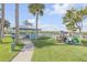 Landscaped common area with gazebo, kayak storage, waterway access, and pet waste station at 49 Jacaranda Cay Ct # 49, New Smyrna Beach, FL 32169