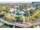 Community space featuring a gazebo, fire pit, and dock access with lush landscaping and serene waterfront views at 49 Jacaranda Cay Ct # 49, New Smyrna Beach, FL 32169