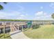 Well-maintained dock and waterfront access to the peaceful waterway, enhanced by lush greenery at 49 Jacaranda Cay Ct # 49, New Smyrna Beach, FL 32169