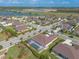 Aerial view of the home showcasing its pool in the backyard and the surrounding neighborhood at 512 Romdini St, New Smyrna Beach, FL 32168