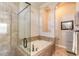 Relaxing bathroom with soaking tub, tiled walls, and arched shelving at 512 Romdini St, New Smyrna Beach, FL 32168