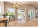 Bright breakfast nook with sliding doors leading to the lanai and pool area at 512 Romdini St, New Smyrna Beach, FL 32168