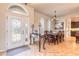 Elegant dining room with beautiful chandelier, ornate door accents, and access to kitchen at 512 Romdini St, New Smyrna Beach, FL 32168