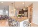 Spacious kitchen island with pendant lighting, barstool seating, and stainless steel appliances at 512 Romdini St, New Smyrna Beach, FL 32168