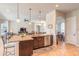 Spacious kitchen with granite countertops, stainless steel appliances and dark wood cabinets at 512 Romdini St, New Smyrna Beach, FL 32168