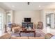 Cozy living room featuring a patterned rug, comfortable seating, and neutral wall color at 512 Romdini St, New Smyrna Beach, FL 32168