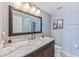 Well-appointed bathroom features a marble countertop, dark wood vanity, and elegant fixtures at 5300 S Atlantic Ave # 5-407, New Smyrna Beach, FL 32169