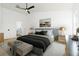 Inviting main bedroom with a large bed, accent lighting and a view into the ensuite bathroom at 5431 Landis Ave, Port Orange, FL 32127