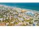 A scenic coastal community with beachfront properties, city buildings, and ocean views at 604 S Atlantic Ave, New Smyrna Beach, FL 32169