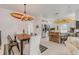 Dining area featuring unique surfboard decor and stylish furnishings near the open kitchen at 604 S Atlantic Ave, New Smyrna Beach, FL 32169