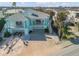 Beautiful coastal home with dual balconies, vibrant colors, and a desirable beachfront location at 604 S Atlantic Ave, New Smyrna Beach, FL 32169