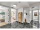 Hallway view featuring tile floors with doorways leading to a bedroom and bathroom at 604 S Atlantic Ave, New Smyrna Beach, FL 32169