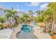 Backyard pool with lush, tropical landscaping creating a private oasis at 604 S Atlantic Ave, New Smyrna Beach, FL 32169