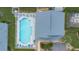 Aerial view of the community pool with ample seating and well-maintained landscaping at 634 Coral Trace Blvd, Edgewater, FL 32132