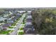 Wide aerial shot showcasing a well-planned residential community with a pond at 634 Coral Trace Blvd, Edgewater, FL 32132