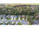 Aerial view of a quiet neighborhood street with well-maintained homes at 634 Coral Trace Blvd, Edgewater, FL 32132
