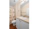 Bathroom with a shower and tub combination, plus a single sink vanity and a large mirror at 634 Coral Trace Blvd, Edgewater, FL 32132