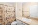 Bathroom with a shower and tub combination, plus a single sink vanity and a large mirror at 634 Coral Trace Blvd, Edgewater, FL 32132