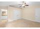 Spacious bedroom with neutral carpet, ensuite bathroom and double closet at 634 Coral Trace Blvd, Edgewater, FL 32132