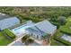 Community pool area with a large, sparkling pool, lots of lounge seating, and well-maintained landscaping at 634 Coral Trace Blvd, Edgewater, FL 32132