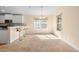 Cozy dining area features breakfast bar and bright window views at 634 Coral Trace Blvd, Edgewater, FL 32132