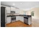 Modern kitchen features stainless steel appliances and ample cabinet space at 634 Coral Trace Blvd, Edgewater, FL 32132