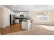 Modern kitchen with stainless steel appliances and breakfast bar seating at 634 Coral Trace Blvd, Edgewater, FL 32132