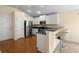 Well-appointed kitchen with stainless steel appliances and convenient breakfast bar at 634 Coral Trace Blvd, Edgewater, FL 32132