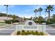 A neighborhood sign reads Coral Trace, with palm trees visible in the background at 634 Coral Trace Blvd, Edgewater, FL 32132