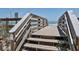 Beach access with stairs and wood slats under a clear blue sky with water views at 6443 Engram Rd, New Smyrna Beach, FL 32169