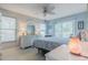 Serene main bedroom with a ceiling fan and private balcony access at 6443 Engram Rd, New Smyrna Beach, FL 32169