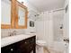 Bathroom with a black vanity, white countertops, and a shower with white curtain at 704 Hillville Dr, Port Orange, FL 32127