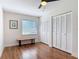 This bedroom features laminate flooring, a ceiling fan, and a large closet at 86 Rains Ct, Ponce Inlet, FL 32127