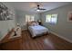 This bedroom has light green walls, wood floors, and a large dresser at 86 Rains Ct, Ponce Inlet, FL 32127