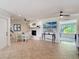 Inviting dining area with a charming fireplace, creating a cozy and elegant space for meals and gatherings at 86 Rains Ct, Ponce Inlet, FL 32127